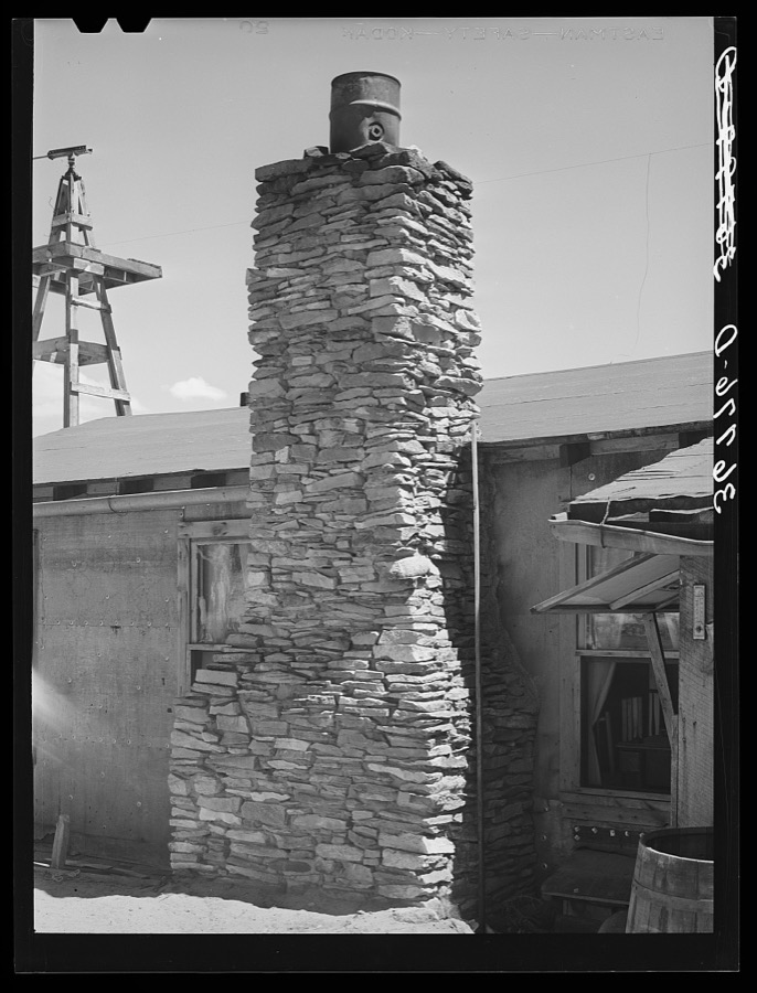 Chimney of the George Huttons' home. Mrs. Hutton built the fireplace and chimney while her husband and son mixed the mud mortar. Pie Town, New Mexico