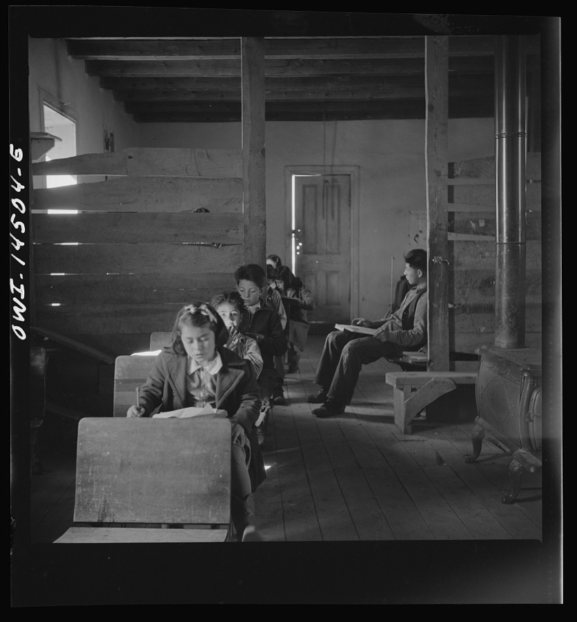 Ojo Sarco, New Mexico. One-room school in an isolated mountainous Spanish-American community, which has eight grades and two teachers. Most of the teaching is in Spanish, the language spoken in the children's homes, and as a result they rarely speak English fluently