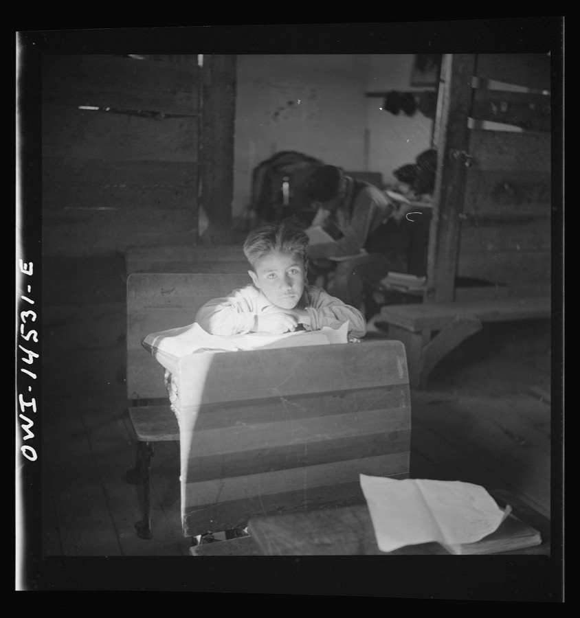 Ojo Sarco, New Mexico. One-room school in an isolated mountainous Spanish-American community, which has eight grades and two teachers. Most of the teaching is in Spanish, the language spoken in the children's homes, and as a result they rarely speak English fluently