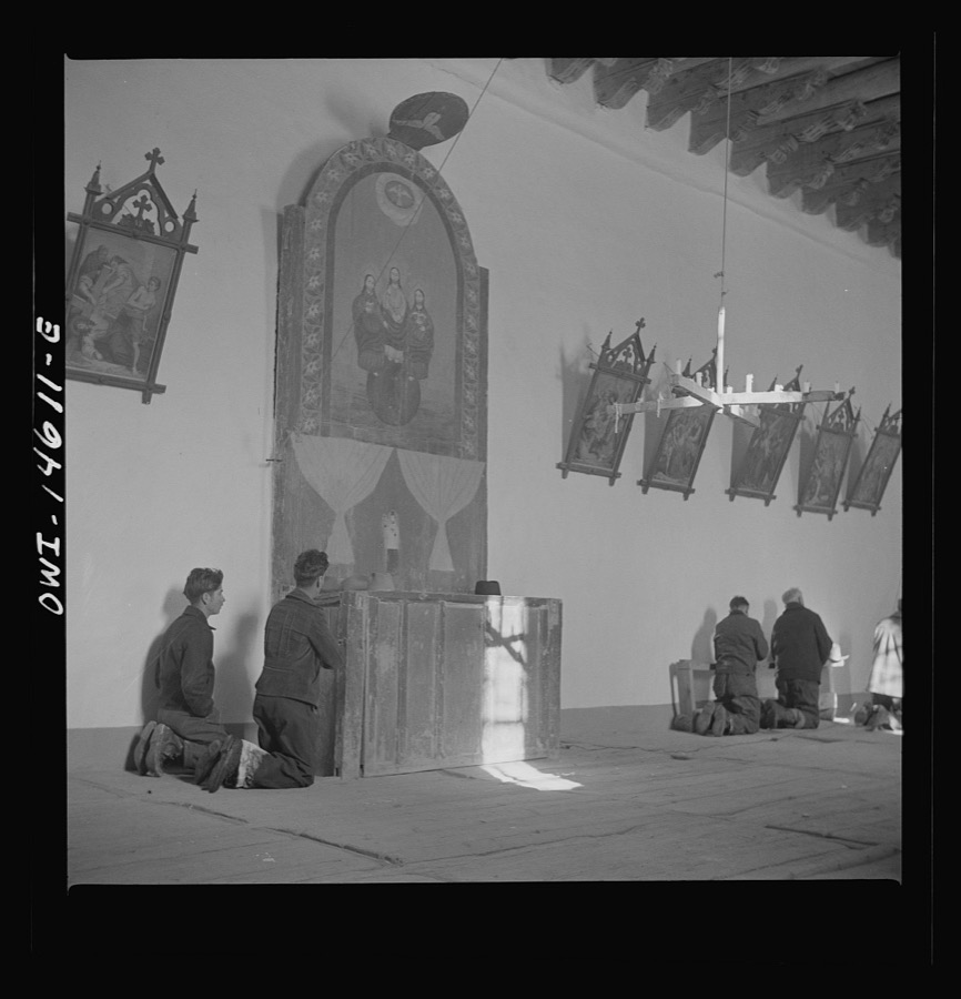 Trampas, New Mexico. Father Cassidy conducting mass at a church which was built in 1700 and is the best-preserved colonial mission in the Southwest