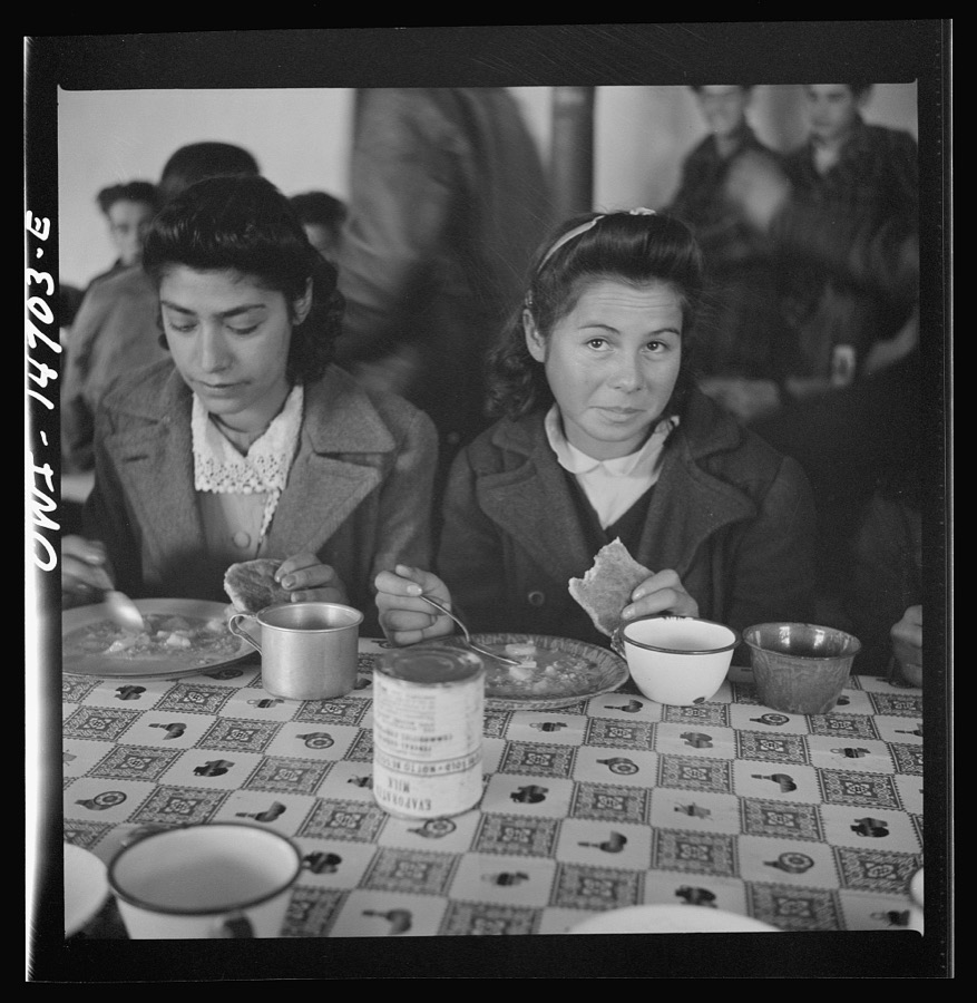 Penasco, New Mexico. A grade school student eating a hot lunch
