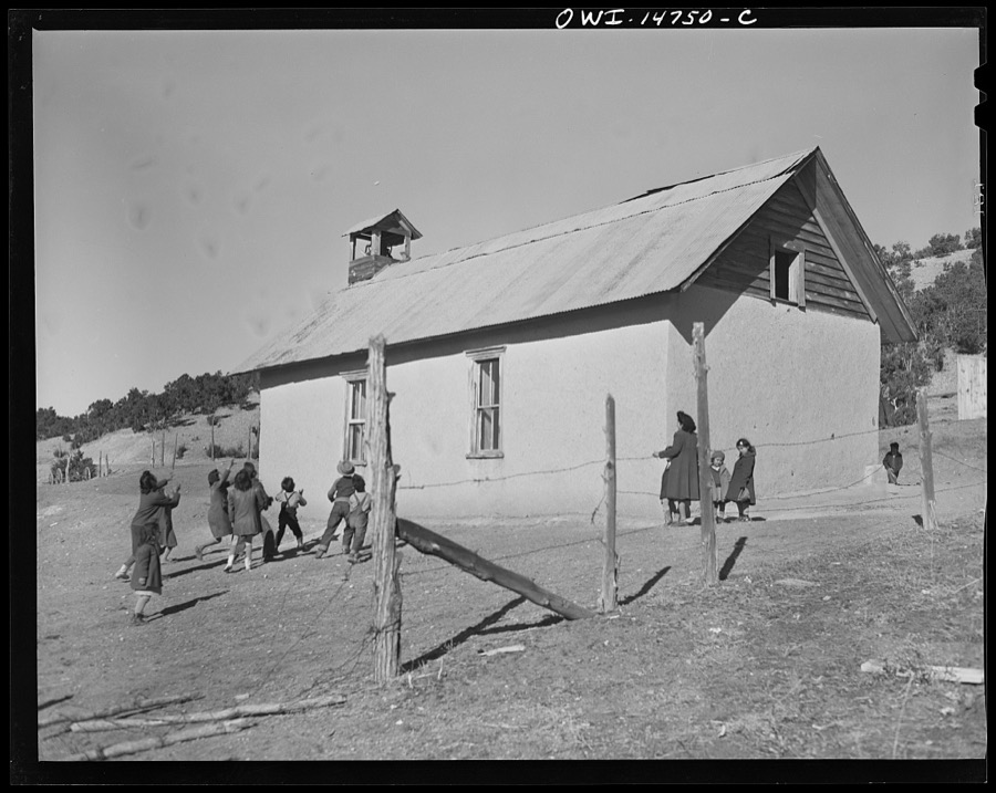 Ojo Sarco, New Mexico. One-room school in an isolated mountainous Spanish-American community, which has eight grades and two teachers. Afternoon recess