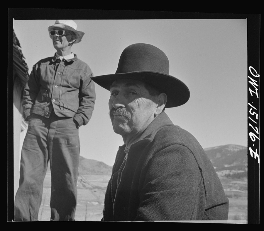 Chacon, Mora County, New Mexico. Idlers at the general store
