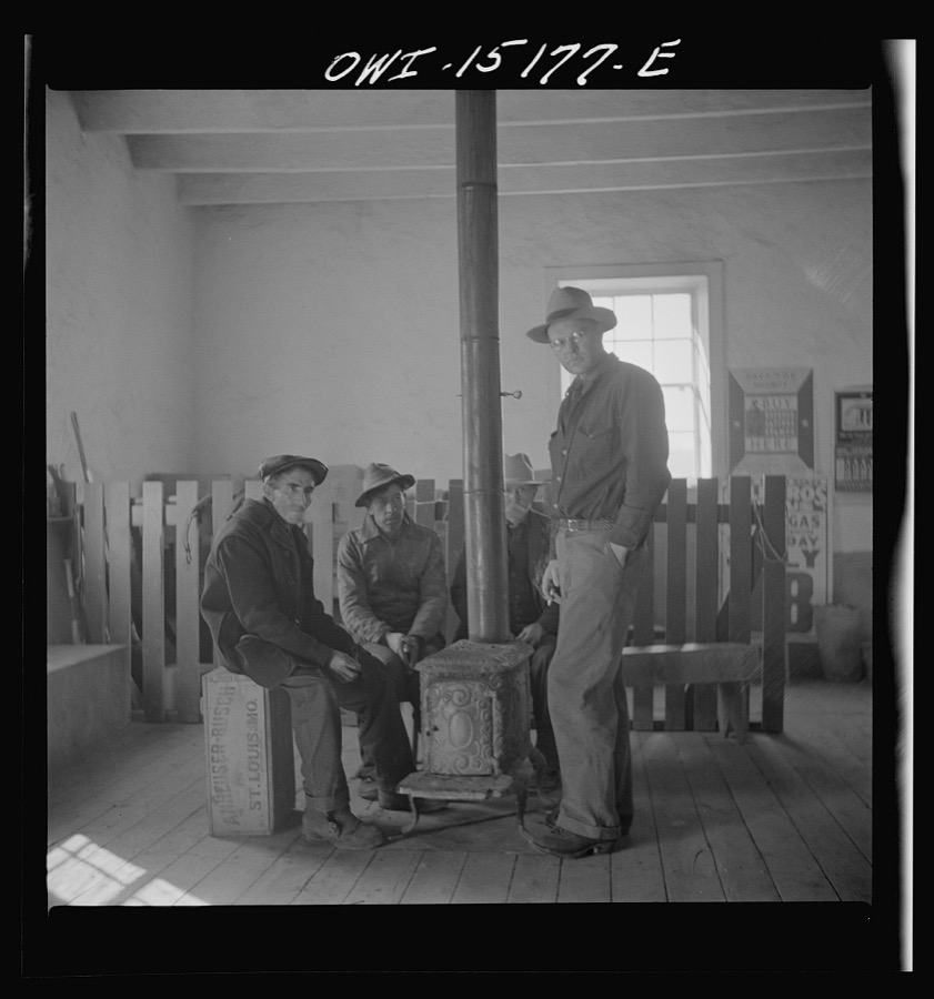Chacon, Mora County, New Mexico. Idlers in the general store