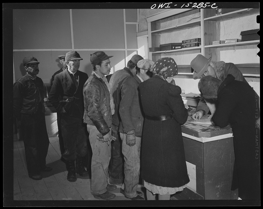 Chacon, Mora County, New Mexico. United States forest ranger in the general store issuing grazing permits to Spanish-American ranchers
