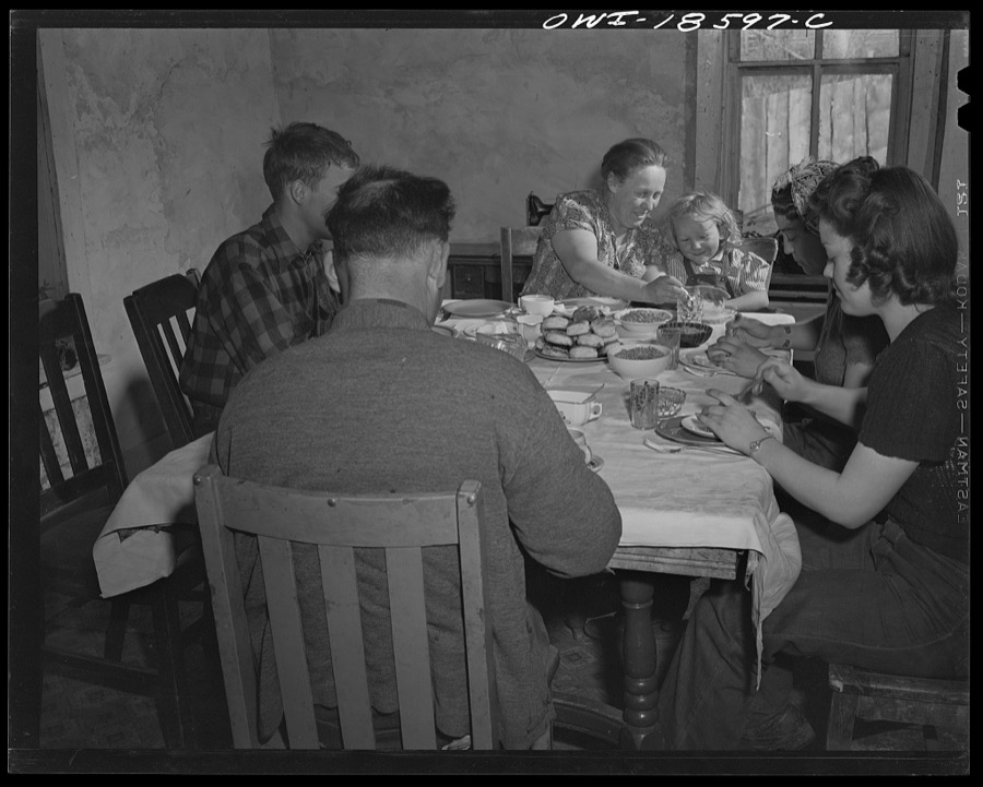Moreno Valley, Colfax County, New Mexico. The Mutz family at dinner