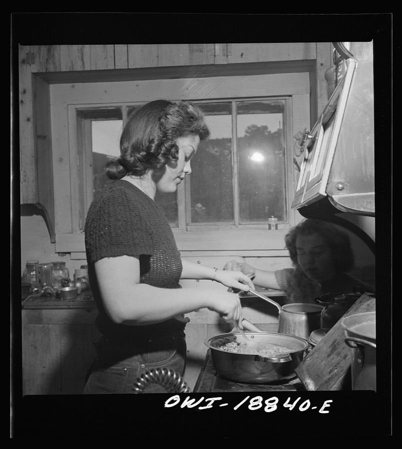 Moreno Valley, Colfax County, New Mexico. The older daughter preparing dinner on George Mutz's farm