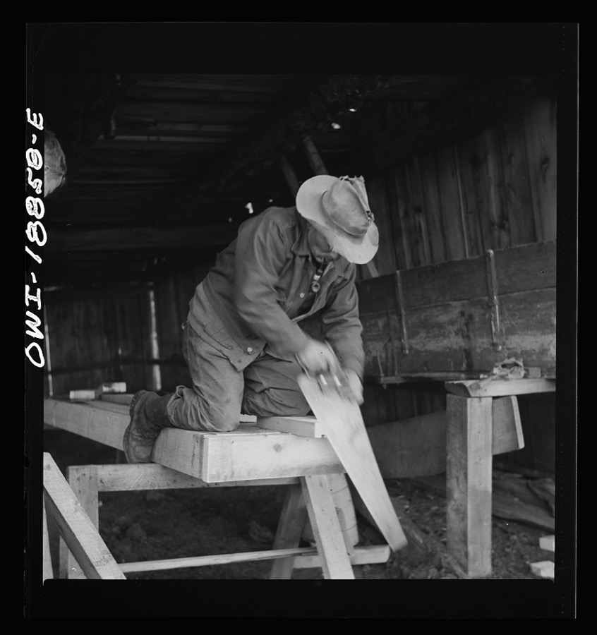 Moreno Valley, Colfax County, New Mexico. George Mutz and his son building a feed trough