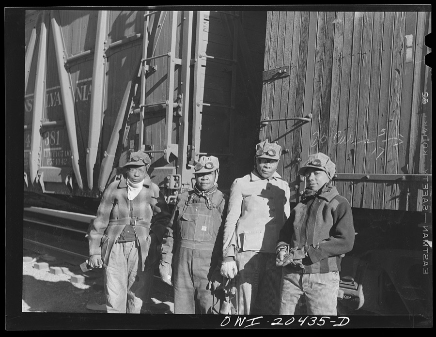 Clovis, New Mexico. Left to right: Almeta Williams, Beatrice Davis, Liza Goss and Abbie Caldwell, employed at the Atchison, Topeka and Santa Fe Railroad yard to clean out potash cars