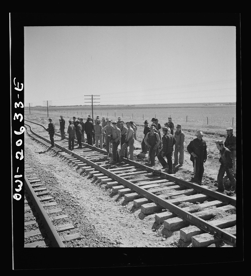 Clovis, New Mexico. Passing a section gang at work on the outskirts along the Atchison, Topeka, and Santa Fe Railroad between Clovis and Vaughn, New Mexico