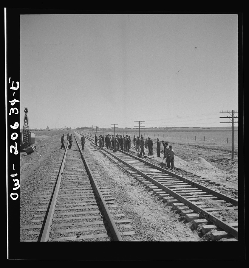 Clovis, New Mexico. Passing a section gang at work on the outskirts along the Atchison, Topeka, and Santa Fe Railroad between Clovis and Vaughn, New Mexico