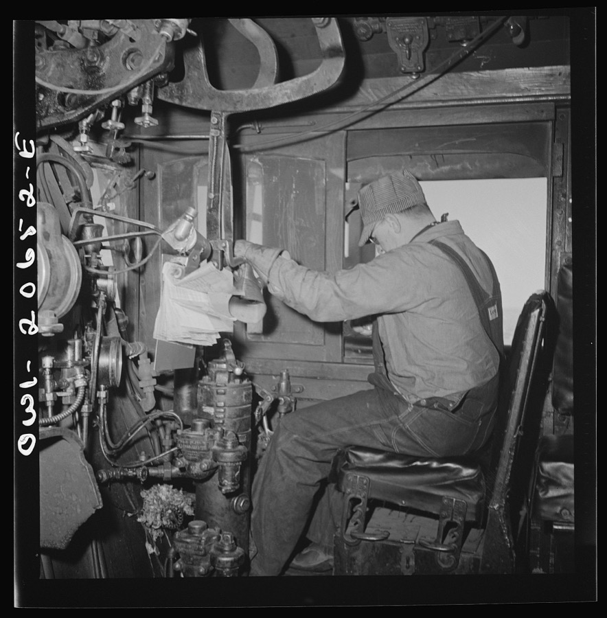 Ricardo, New Mexico. Engineer in his cab about to start the train along the Atchison, Topeka, and Santa Fe Railroad between Clovis and Vaughn, New Mexico