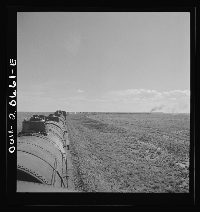 Buchanan, New Mexico. Rounding a long curve approaching the town along the Atchison, Topeka, and Santa Fe Railroad between Clovis and Vaughn, New Mexico