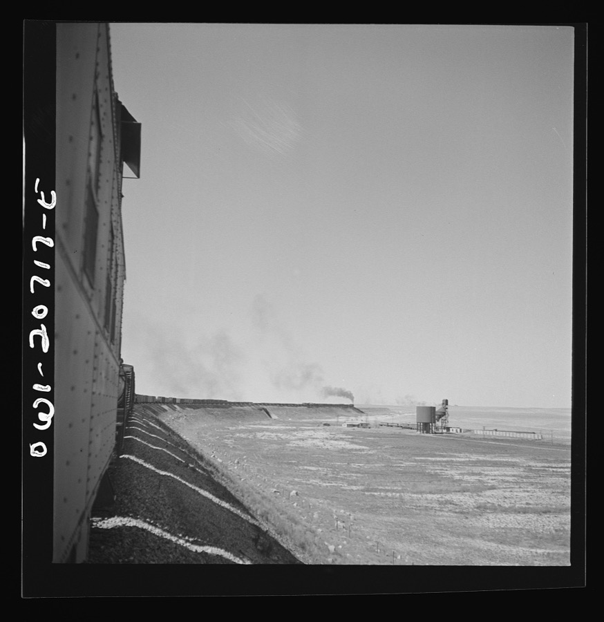 Vaughn, New Mexico. A train on the Atchison, Topeka and Santa Fe Railroad between Vaughn and Belen, New Mexico passing over the Southern Pacific Railroad tracks