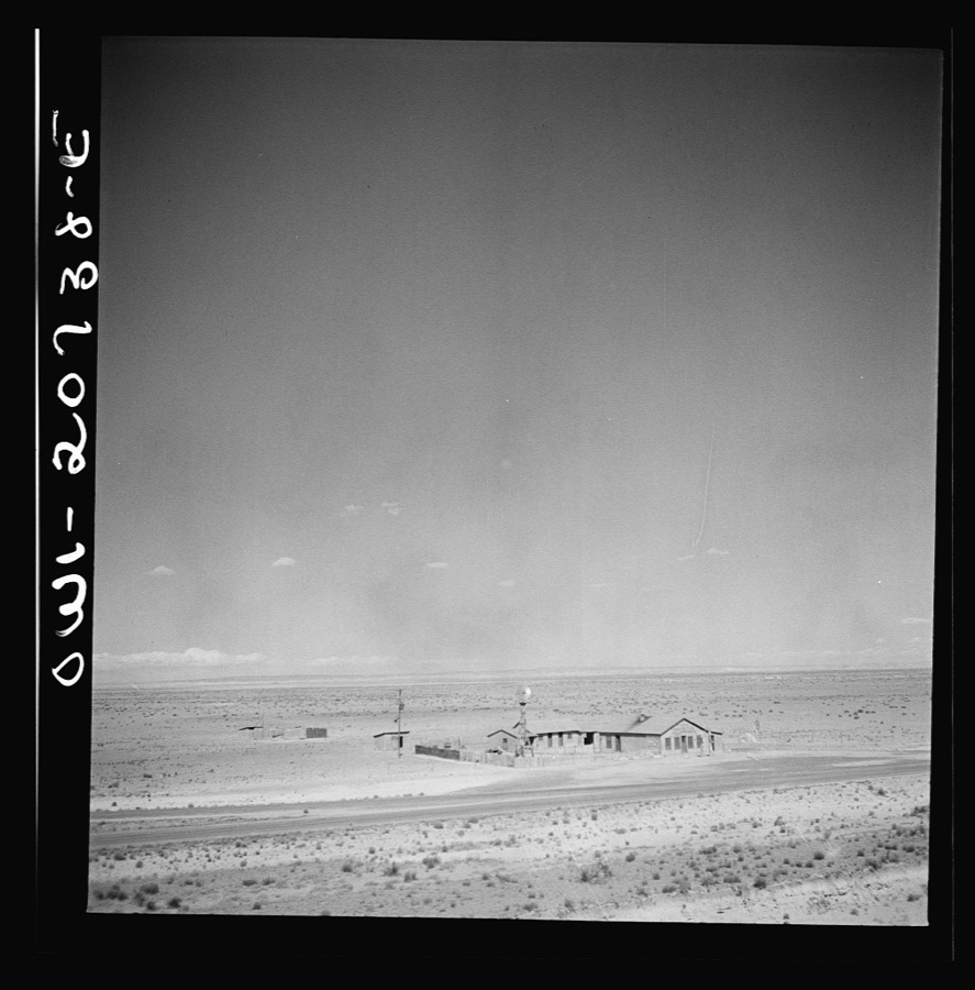 Willard, New Mexico. Passing a filling station in the desert country along the Atchison, Topeka and Santa Fe Railroad between Vaughn and Belen, New Mexico