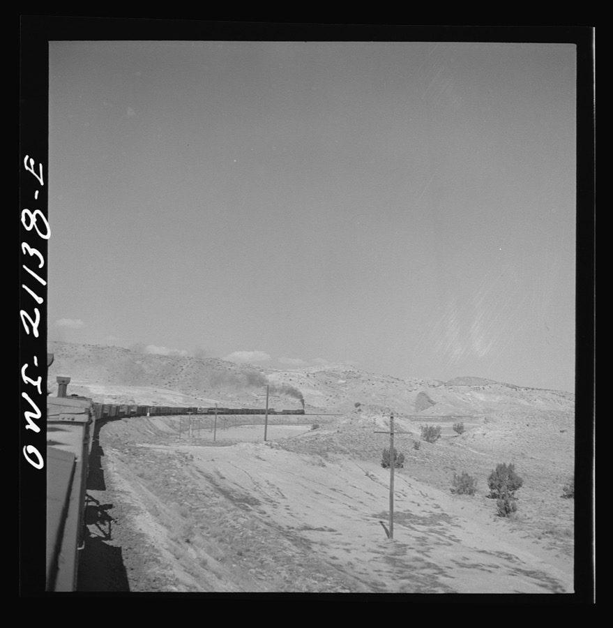 Quirk (vicinity), New Mexico. A train rounding a curve along the Atchison, Topeka and Santa Fe Railroad between Belen and Gallup, New Mexico