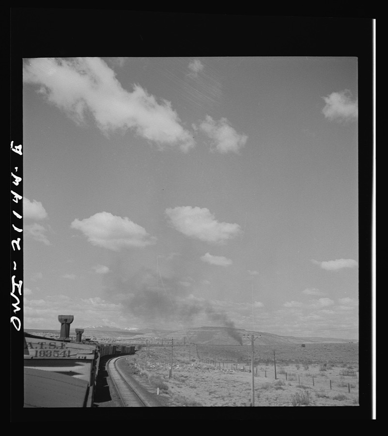 Quirk (vicinity), New Mexico. A train rounding a curve along the Atchison, Topeka and Santa Fe Railroad between Belen and Gallup, New Mexico