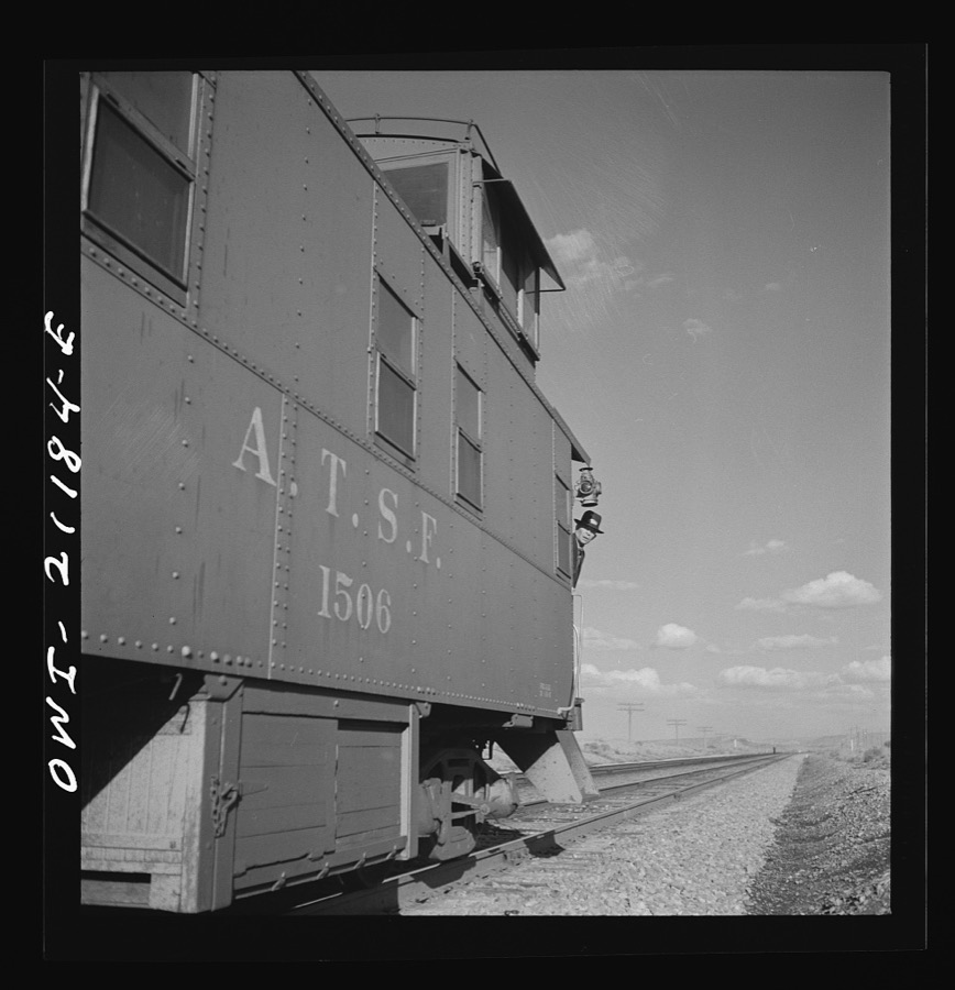Thoreau, New Mexico. A train stopping at a siding along the Atchison, Topeka and Santa Fe Railroad between Belen and Gallup, New Mexico