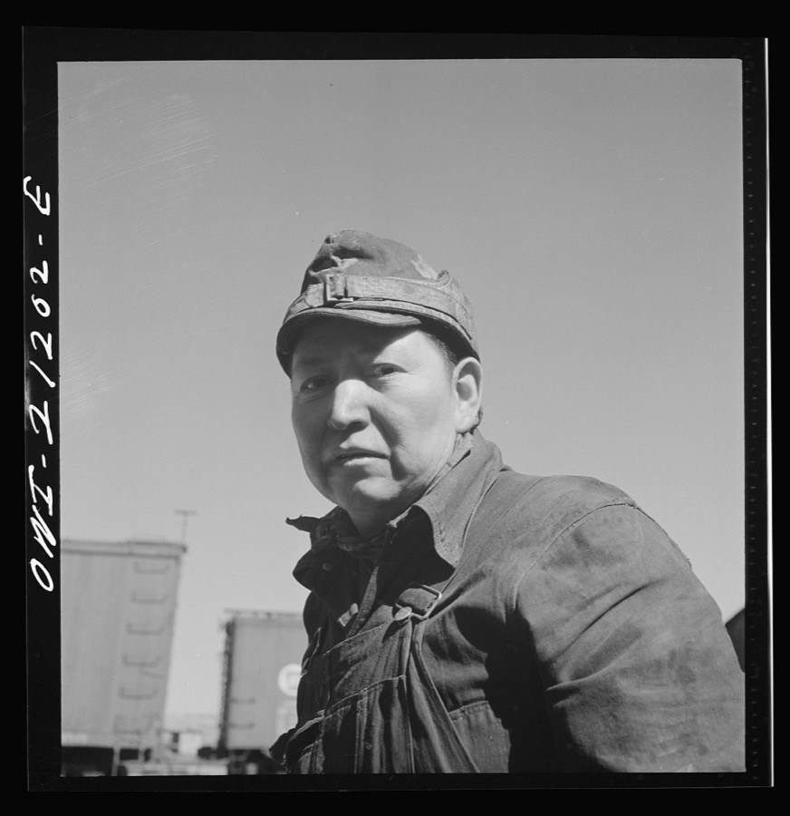 Gallup, New Mexico. Ben Acory, an Indian worker employed at the Atchison, Topeka and Santa Fe Railroad car shops