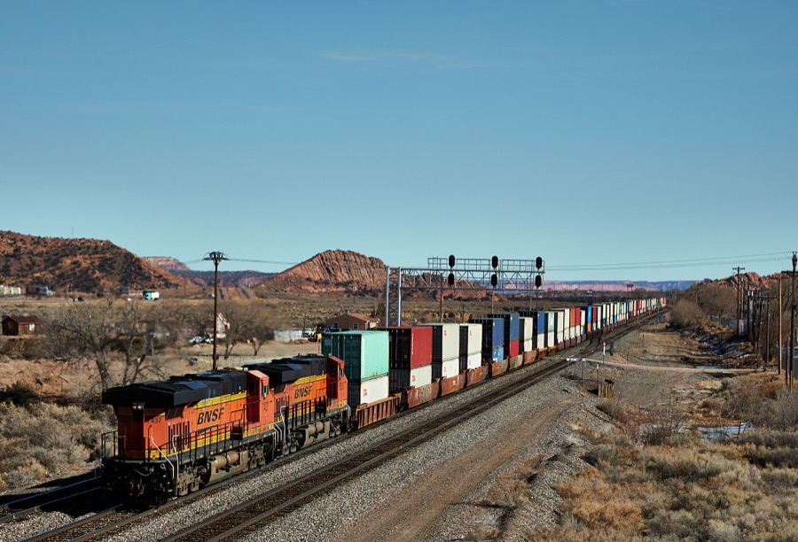 Two heavy diesel engines pull a long freight train into Gallup, New Mexico, a small city near the Arizona border in far-western New Mexico