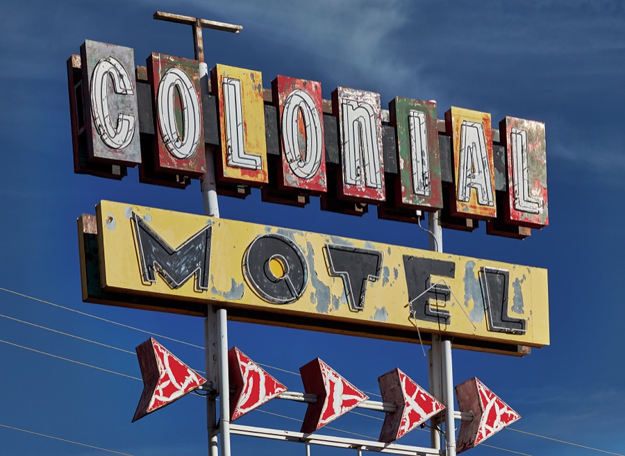 A well-worn neon sign for the Colonial Motel on historic U.S. Route 66 in Gallup, a small city near the Arizona border in far-western New Mexico
