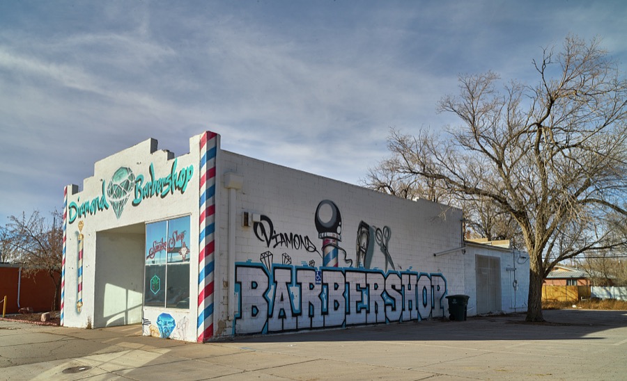 The Diamond Barber Shop in Gallup, a small city near the Arizona border in far-western New Mexico notes, in its store window, that it is also a smoke shop