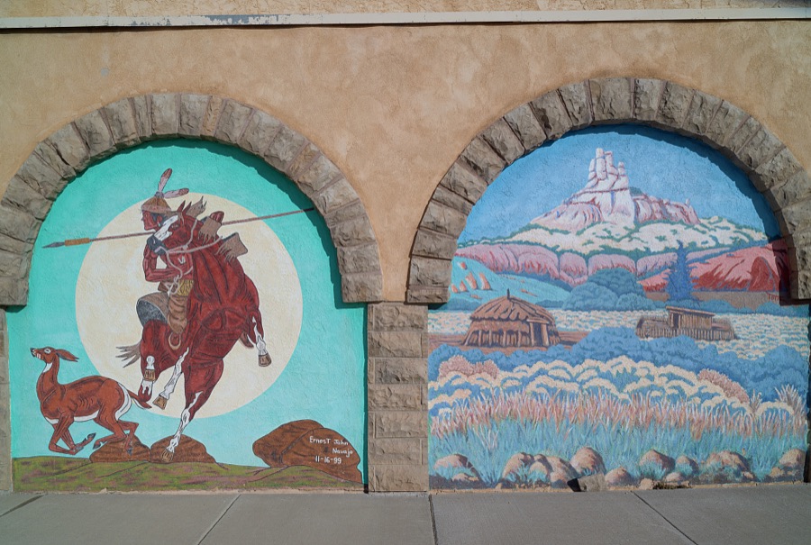 Small mural portals on a wall of the Rex Museum, once a brothel, later a grocery store, and now (as of 2021) a historical museum in Gallup, a small city near the Arizona border in far-western New Mexico