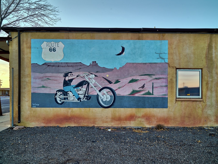 A fading motorcyclist-themed mural on the side of the Lux Theatre, a 1937 movie house that has been abandoned since a boiler fire damaged the building in 1970 in the small New Mexico city of Grants, along old U.S. Route 66 between Albuquerque and Gallup
