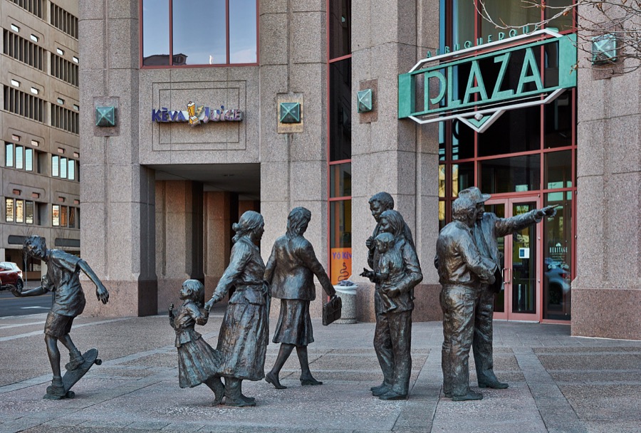 Glenna Goodacre "Sidewalk Society" sculpture group enhances the entrance to the Albuquerque Plaza building, at 22 stories the highest structure in Albuquerque, the largest city in New Mexico