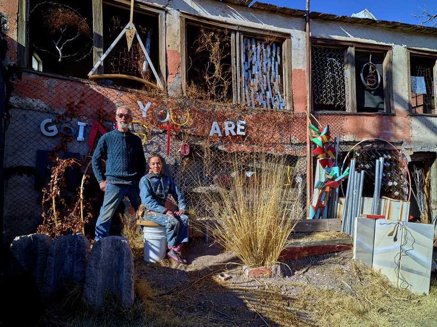 Master woodworker, Mike Lagg and prolific artist, Paula Wilson take a break among the pieces of their art installation in the small, south-central New Mexico town of Carrizozo