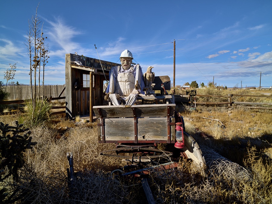 According to local lore in the small south-central New Mexico town of Carrizozo, with a population of 1,000 or so (as of 2021), a neighbor saw, down the road, an installation that some call "outsider art," made from reclaimed pieces of abandoned buildings, accented by various vintages of old cars
