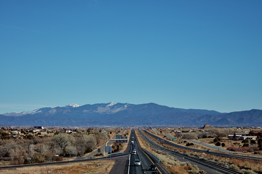 View of U.S. Interstate Highway 25 in the vast valley southwest of Santa Fe, New Mexico, near the settlement of Los Cerrillos