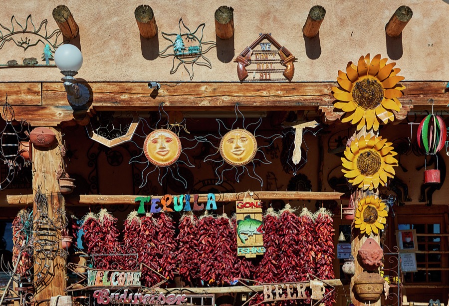 Real Mexican-style hot peppers, locally called chiles (we say real because many other displays are metal art) are among hundreds of colorful offerings displayed outside the Casa Cristal Pottery home-and-garden roadside store near Velarde in northern New Mexico