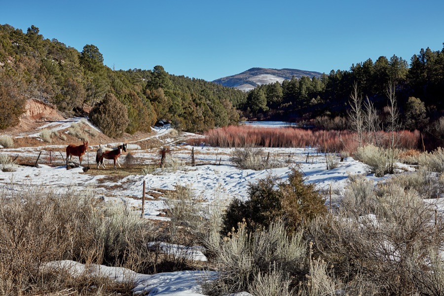 Valley and mountain view near the community of Truchas, about halfway along what's called the "High Road," a winding route through the Sangre de Cristo mountains to and from the New Mexico capital city of Santa Fe and the art and shopping mecca of Taos