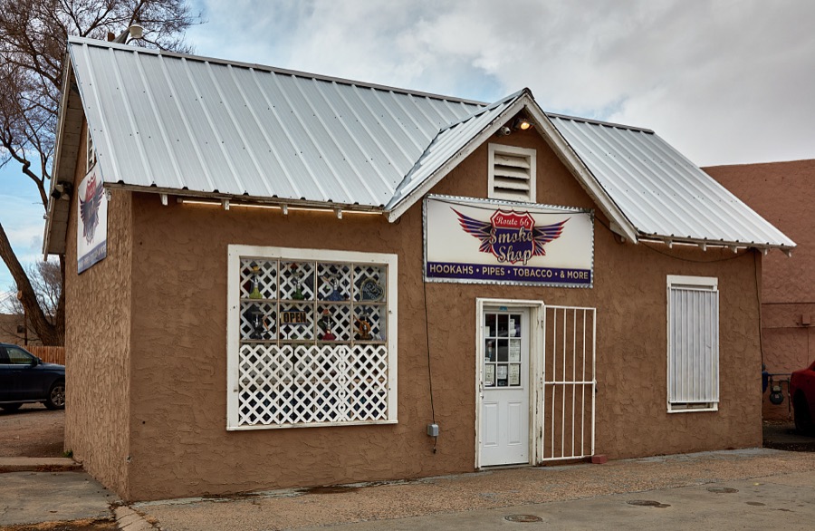 The humble building in the village of Los Lunas, the seat of Valencia County, New Mexico, south of Albuquerque, is now (as of 2021) a tobacco and hookah shop that doesn't look historic