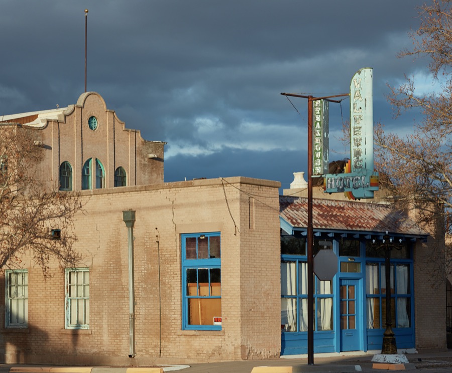 The corner, and a weathered sign, of the 1919 Val Verde Hotel and Steakhouse in Socorro, a small city in central New Mexico