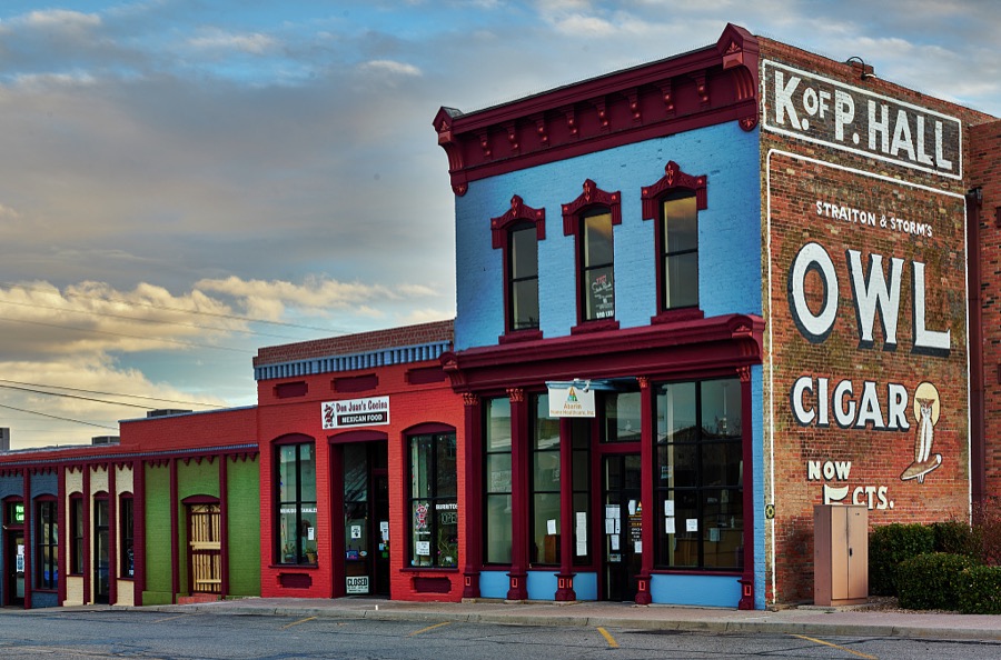 A classic Owl Cigar advertising sign dominates a block of Socorro, a small city in central New Mexico