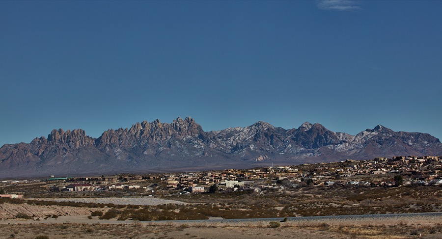 A distant view of Tortugas, New Mexico, a community at the base of the Organ Mountain Range below Las Cruces