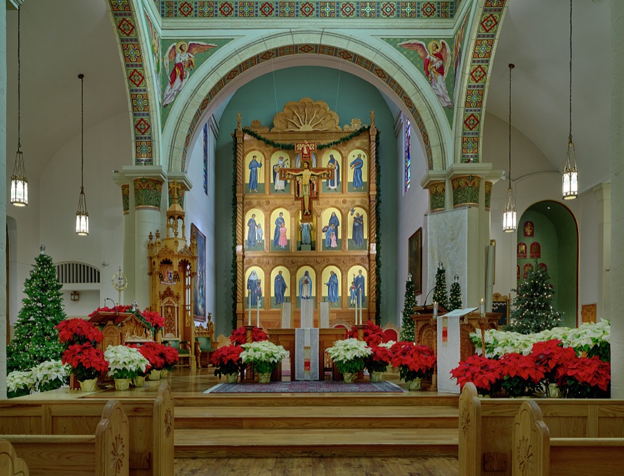 When one faces the front of the sanctuary at the Cathedral Basilica of St. Francis of Assisi in Santa Fe, New Mexico, eyes are drawn to the Lamb of God, angels in proclamation, and a replica of the San Damiano Cross, a large Romanesque rood cross that hung in an abandoned chapel near Assisi in Italy, suspended above the altar