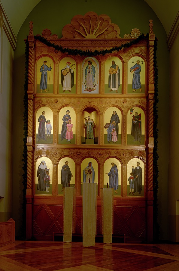 The altar screen, or reredos, was carved by Taos, New Mexico, woodcarvers Robert Lavadie and Paul Martinez and installed in 1986 at the Cathedral Basilica of St. Francis of Assisi in Santa Fe, New Mexico