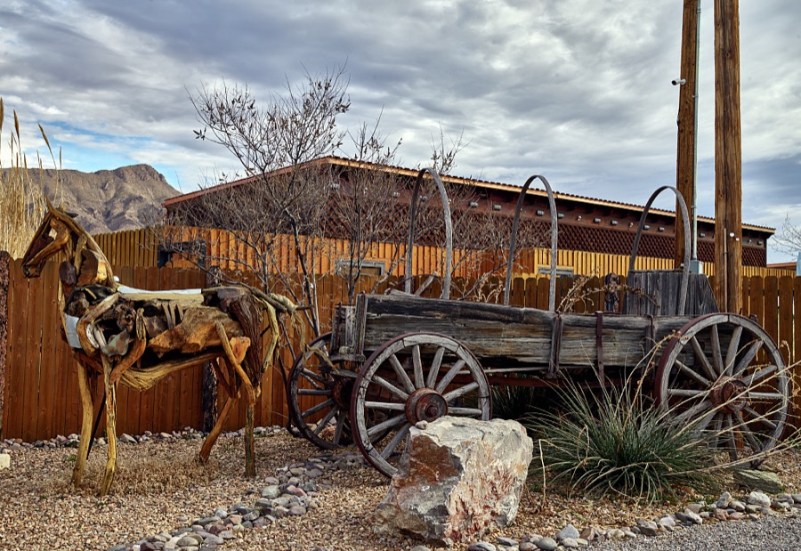 A metal-art horse pulls a vintage freight wagon outside the Geronimo Springs Museum and Sierra County Historical Society in Truth or Consequences, New Mexico