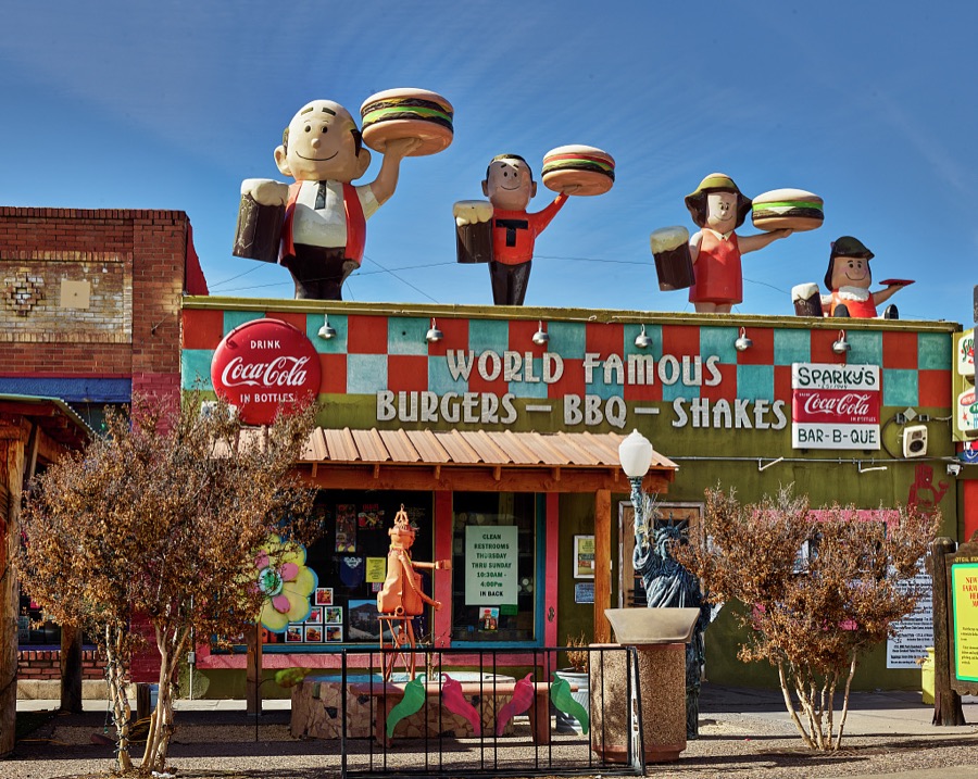 A parade of burger boys and girls dominates the skyline at Sparky's Burgers & BBQ (barbecue), a must-see roadside attraction in tiny Hatch, New Mexico, north of Las Cruces, that offers not only green-chili cheeseburgers, espresso, and other coffee drinks but also what one might call vintage, sometimes giant and funky, memorabilia assembled over 20 years by Sparky's owners, Josie Nunn and her husband, Teako
