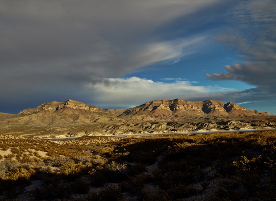 View of the distant mountains at dusk beyond the Caballo Springs Reservoir in Sierra County, New Mexico