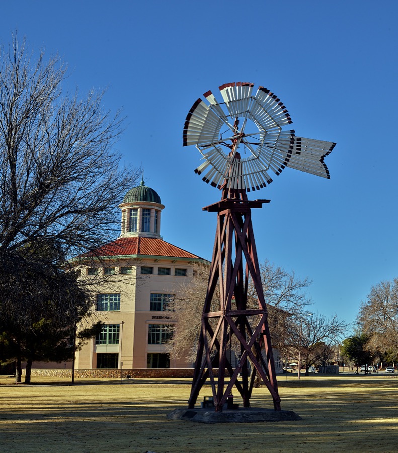 A windmill outside the building accents the agricultural curriculum emphasized at Skeen Hall behind it