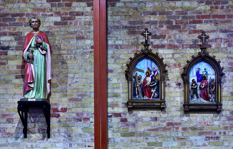 A religious icon and adjacent art in the sanctuary of the Basilica of San Albino on the plaza of Mesilla (locally called Old Mesilla), a historic town adjacent to Las Cruces, the hub city of southern New Mexico