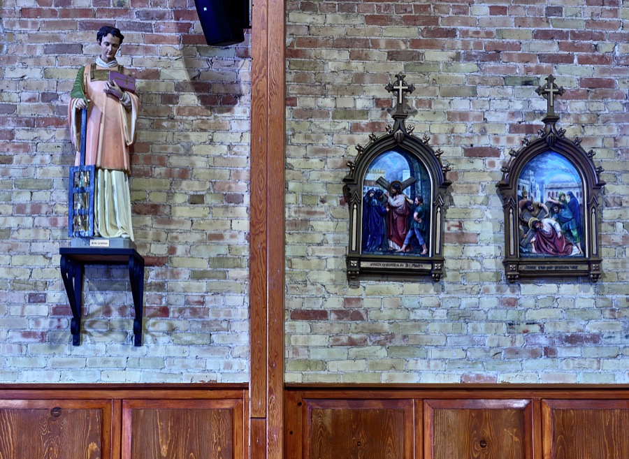 A religious icon and adjacent art in the sanctuary of the Basilica of San Albino on the plaza of Mesilla (locally called Old Mesilla), a historic town adjacent to Las Cruces, the hub city of southern New Mexico