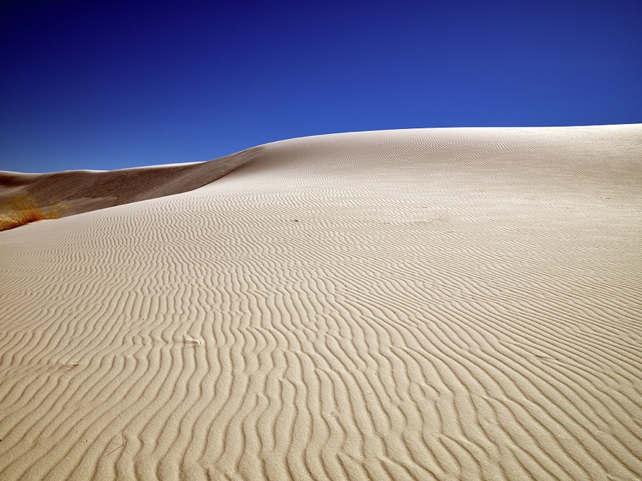 The site's trademark rippling waves accent the experience at White Sands National Park in southern New Mexico's Tularosa Basin