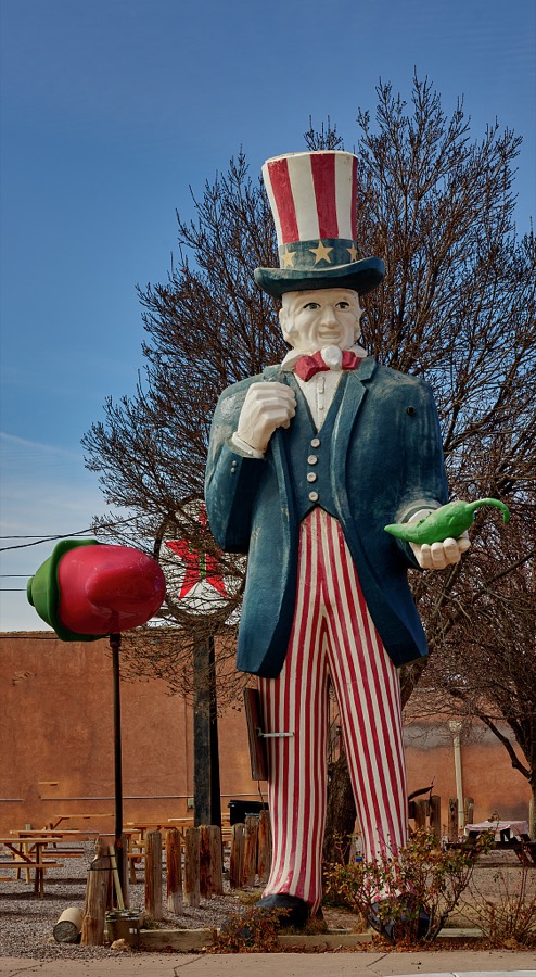 An oversized Uncle Sam, here as a hot-pepper fan, at Sparky's Burgers & BBQ (barbecue), a must-see roadside attraction in tiny Hatch, New Mexico, north of Las Cruces, that offers not only green-chili cheeseburgers, espresso, and other coffee drinks but also what one might call vintage, sometimes giant and funky, memorabilia assembled over 20 years by Sparky's owners, Josie Nunn and her husband, Teako