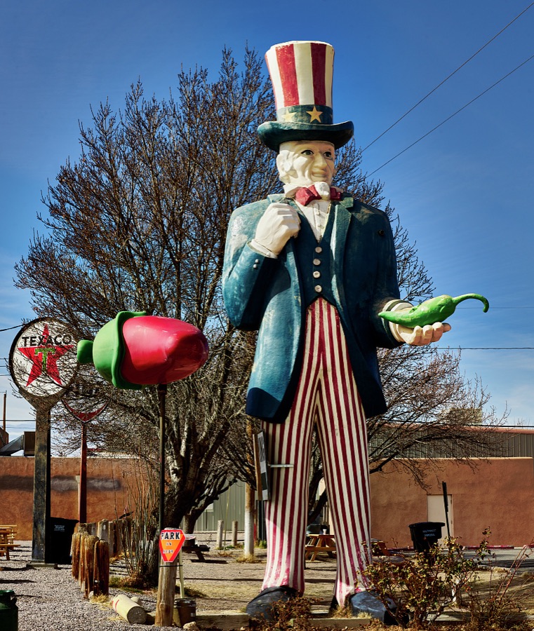 An oversized Uncle Sam, here as a hot-pepper fan, at Sparky's Burgers & BBQ (barbecue), a must-see roadside attraction in tiny Hatch, New Mexico, north of Las Cruces, that offers not only green-chili cheeseburgers, espresso, and other coffee drinks but also what one might call vintage, sometimes giant and funky, memorabilia assembled over 20 years by Sparky's owners, Josie Nunn and her husband, Teako