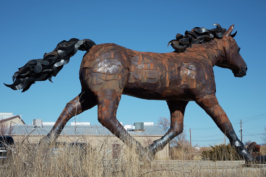 Artist Don Kennell's metal-art sculpture, to which he refers as, simply, "Mustang," stands outside the La Puerta Originals store in the New Mexico capital city of Santa Fe